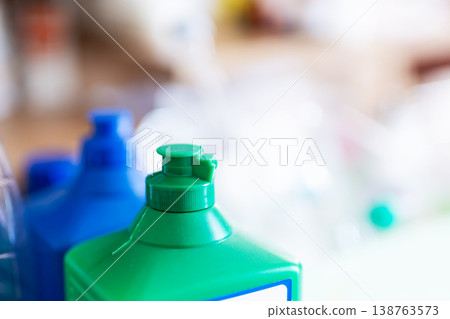 Colorrich detergent bottles arranged on counter with soft natural morning illumination 138763573