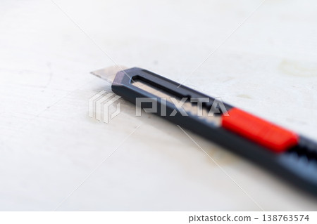 Clear knife display. High resolution picture showcasing safety features on utility knife Clear knife display. High resolution picture showcasing safety features on utility knife 138763574