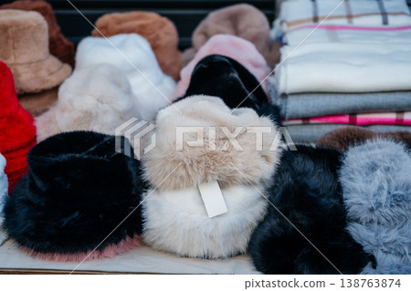 Soft Pastel Fur Hats Showcased. Arranged Cozy Fur Hats In Pastel Shades With Price Tags Attached Soft Pastel Fur Hats Showcased. Arranged Cozy Fur Hats In Pastel Shades With Price Tags Attached 138763874