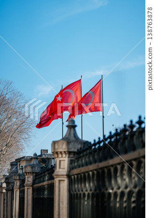 Turkish Flags Sway Above Historic Building Surrounded By Snowcovered Trees And Serious Atmosphere Turkish Flags Sway Above Historic Building Surrounded By Snowcovered Trees And Serious Atmosphere 138763878