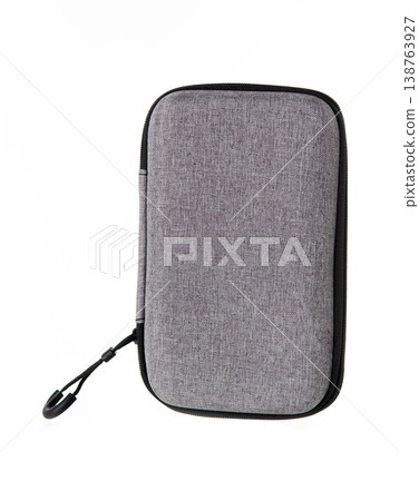 Grey hard shell textile organizer case with zipper isolated on white background, portable storage for electronics. 138763927