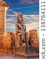 Sunset view of Ramesses II seated by the Luxor Temple entrance, Egypt 138764111