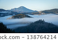 Late autumn landscape scenery with fog rolling through the valley and mountains peaking, Slovakia 138764214