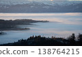 Sunrise landscape with valley full of inversion fog and snowy mountains in the background, Slovakia 138764215