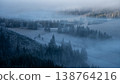 Winter forest with frozen trees and morning fog rolling in, Slovakia 138764216