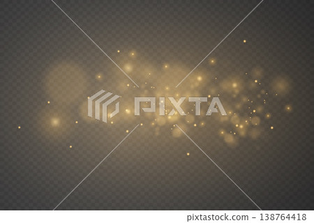 Golden glowing particles creating a magical light effect overlaying transparency 138764418