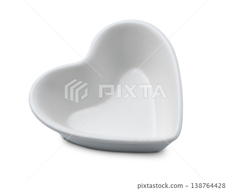 Heart shaped white bowl or dish isolated top view. White ceramic bowl in heart shape isolate. Heart shaped white bowl or dish isolated top view. White ceramic bowl in heart shape isolate. 138764428
