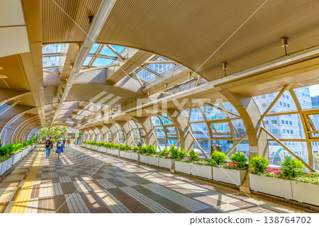 A pedestrian overpass connecting to Osaki New City, located at the east exit of Osaki Station in Shinagawa Ward, Tokyo. A pedestrian overpass connecting to Osaki New City, located at the east exit of Osaki Station in Shinagawa Ward, Tokyo. 138764702
