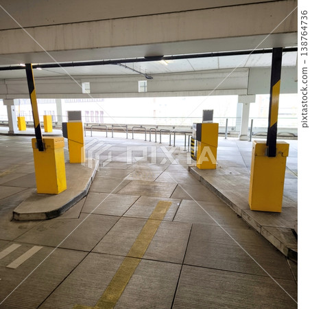 An empty multi-level parking lot with yellow terminals 138764736