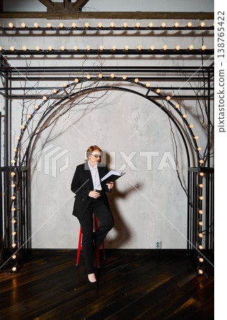 Woman with red hair delivers engaging speech confidently Woman with red hair delivers engaging speech confidently 138765422