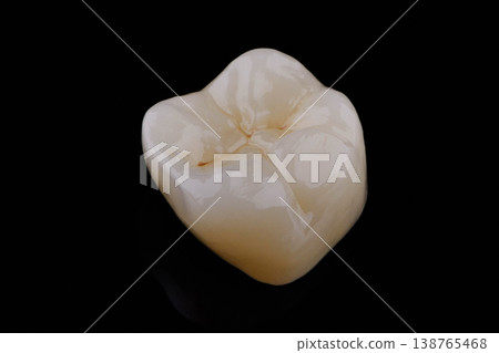 High-quality zirconia dental crown on white background. Dental ceramic crown professional dental lab High-quality zirconia dental crown on white background. Dental ceramic crown professional dental lab 138765468