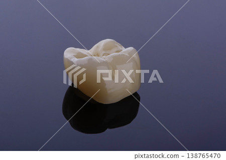 High-quality zirconia dental crown on white background. Dental ceramic crown professional dental lab 138765470