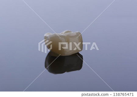 High-quality zirconia dental crown on white background. Dental ceramic crown professional dental lab High-quality zirconia dental crown on white background. Dental ceramic crown professional dental lab 138765471