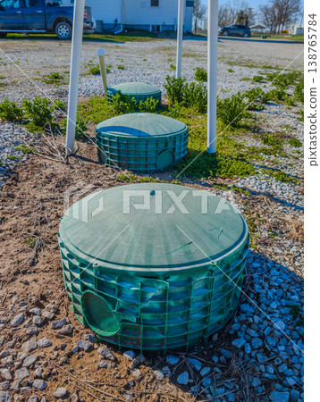 Septic covers over a biological leach system in a small town Septic covers over a biological leach system in a small town 138765784