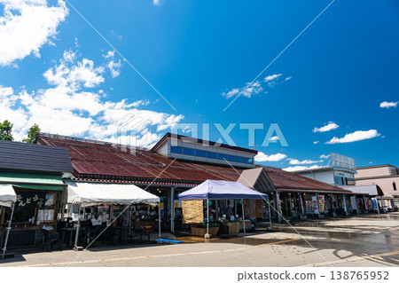 Shopping at Michi-no-Eki Yunotani - Local Products Center, Miyuki no Sato, under a clear summer sky, Yoshida, Uonuma City, Niigata Prefecture 138765952