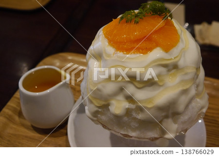 Shaved ice topped with white velvet sauce Shaved ice topped with white velvet sauce 138766029