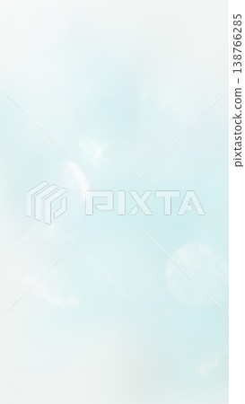A light blue, fluffy bokeh gradient background. A light blue, fluffy bokeh gradient background. 138766285