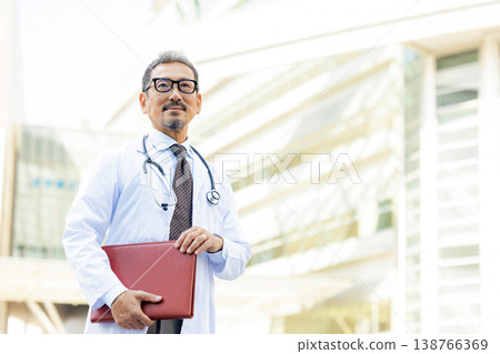 A man wearing a white suit A man wearing a white suit 138766369