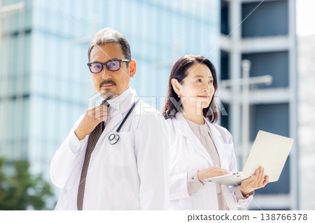 A senior male doctor in a white coat at a hospital A senior male doctor in a white coat at a hospital 138766378