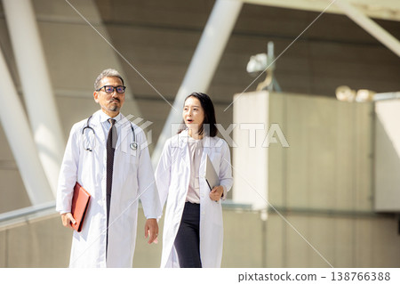 Senior doctor and nurse working in hospital 138766388