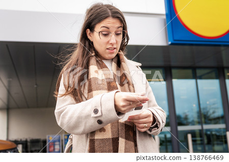Cost of Living Crisis Woman Examining Shopping Bill 138766469
