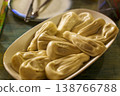 Georgian khinkali juicy meat dumplings on a ceramic plate in a restaurant. High quality photo 138766788
