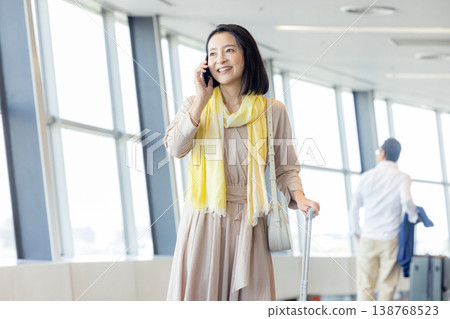 Woman operating a smartphone Woman operating a smartphone 138768523
