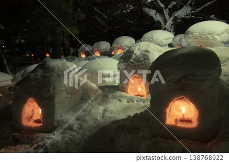 Snow igloo and candle 138768922