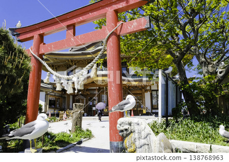 The torii gate and worship hall of Kabushima Shrine stand out against the blue sky. The torii gate and worship hall of Kabushima Shrine stand out against the blue sky. 138768963
