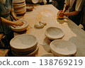 female hands in flour closeup kneading dough on table 138769219