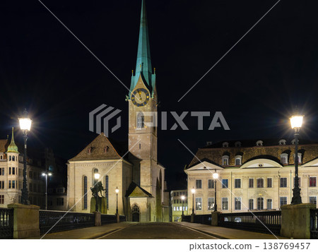 Night City Serenity. Illuminated Cathedral Arch Over Peaceful Square 138769457