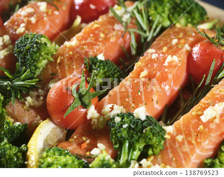 Delicious Ovencooked Salmon With Fresh Vegetables And Seasonings Delicious Ovencooked Salmon With Fresh Vegetables And Seasonings 138769523