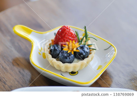 cheese tart , tart with strawberry and blueberry topping or strawberry tart or strawberry cheese tart cheese tart , tart with strawberry and blueberry topping or strawberry tart or strawberry cheese tart 138769869