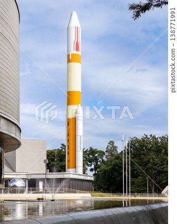 The H-II rocket and fountain soaring into the blue sky. The H-II rocket and fountain soaring into the blue sky. 138771991