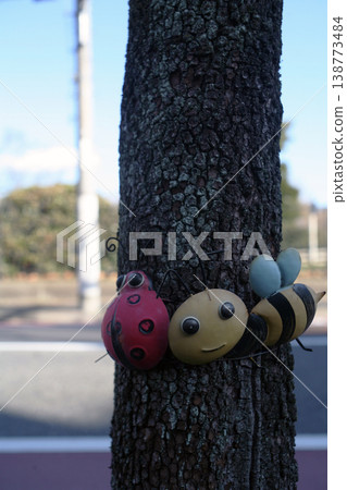 Decorations attached to street trees 138773484