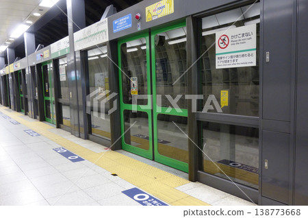 Empty station platform doors on the subway's Namboku Line Empty station platform doors on the subway's Namboku Line 138773668