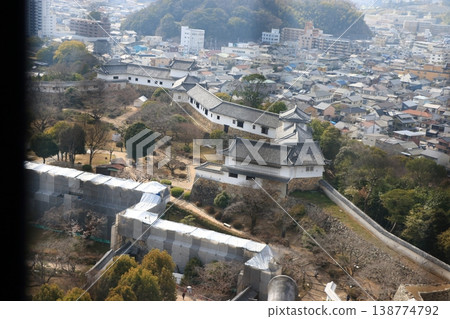 The view of Himeji City from the windows at the top of the tenshu or castle keep of Himeji Castle in Japan 138774792