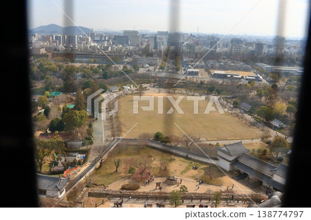 The view of Himeji City from the windows at the top of the tenshu or castle keep of Himeji Castle in Japan 138774797