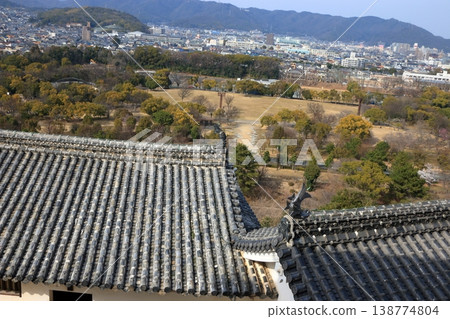 The view of Himeji City from the windows at the top of the tenshu or castle keep of Himeji Castle in Japan The view of Himeji City from the windows at the top of the tenshu or castle keep of Himeji Castle in Japan 138774804