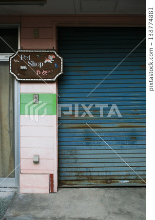 The blue shutter of the store The blue shutter of the store 138774881