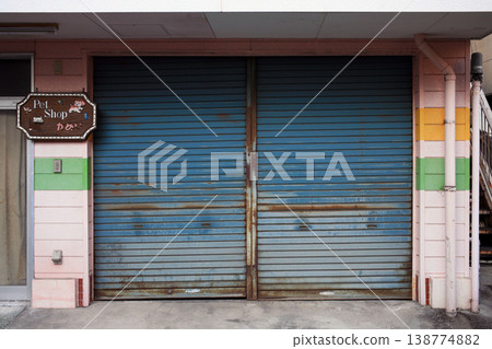 The blue shutter of the store The blue shutter of the store 138774882