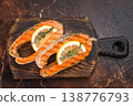 Closeup grilled salmon steaks chum with juicy texture and char marks, thyme and lemon on dark background 138776793