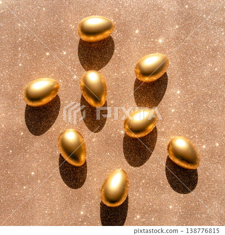 Golden eggs on glitter background with dramatic shadows conveying luxury and celebration Golden eggs on glitter background with dramatic shadows conveying luxury and celebration 138776815