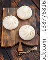Nikuman steamed buns with dipping sauce and sesame seeds on rustic wooden background, Asian street food with copy space 138776816