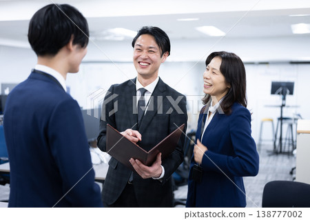 Smiling manager and on-site staff Smiling manager and on-site staff 138777002
