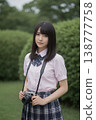 A high school girl with a camera 138777758