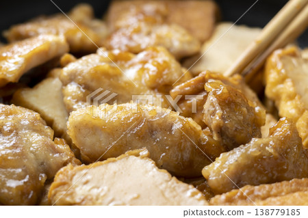 A scene from the cooking process of stir-fried chicken and fried tofu. A scene from the cooking process of stir-fried chicken and fried tofu. 138779185