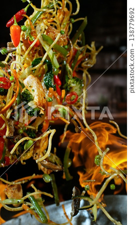Freeze Motion of Flying Asian Meal with Vegetable and Meat into Wok Pan Freeze Motion of Flying Asian Meal with Vegetable and Meat into Wok Pan 138779692