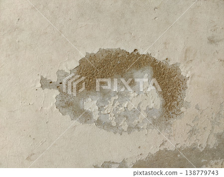 Wall damaged by water seepage with peeling paint and decayed plaster surface indoors Wall damaged by water seepage with peeling paint and decayed plaster surface indoors 138779743
