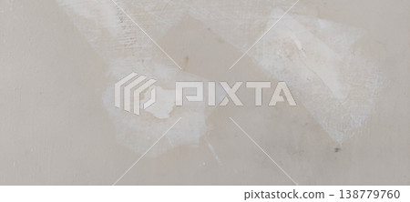 Plaster patches on a wall showing the start of a home repair project Plaster patches on a wall showing the start of a home repair project 138779760